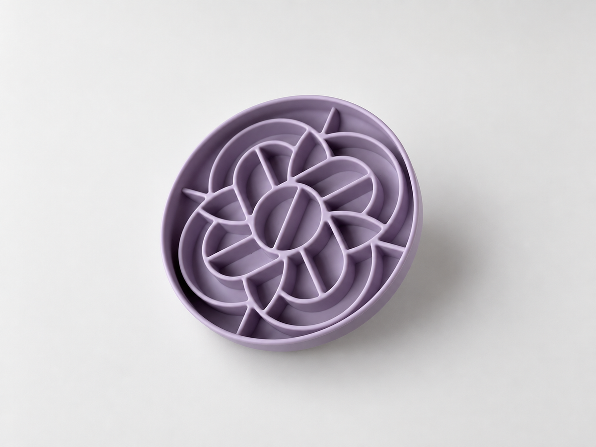 Lilac silicone slow feeder dog bowl with raised mooncake-inspired pattern