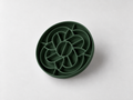 Hunter Green silicone slow feeder dog bowl with raised mooncake-inspired pattern