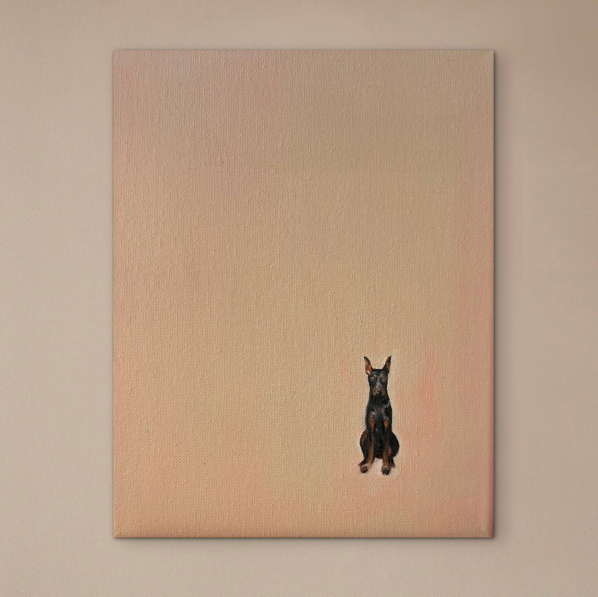 Commissioned oil portrait of a seated Doberman on a soft peach canvas